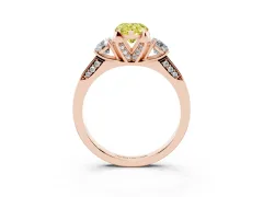 Fancy Yellow Pear Cut Diamond Three-Stone Ring Set in Rose gold with Pavé Band and Smaller Side Stones