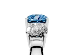 Fancy Blue Cushion Cut Diamond Three-Stone Ring Set in Platinum with Round Side Stones and Classic Band