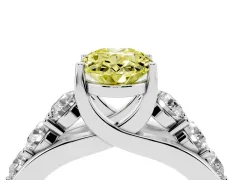 Fancy Yellow Oval Cut Diamond Pavé Engagement Ring Set in White gold with Prong Setting