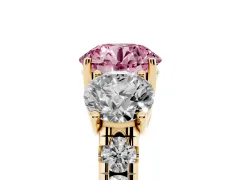 Fancy Pink Round Cut Diamond Three-Stone Ring Set in Yellow gold with Pavé Band