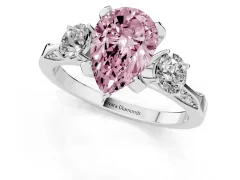 Fancy Pink Pear Cut Diamond Three-Stone Ring Set in White gold with Pavé Band and Smaller Side Stones