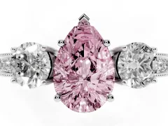 Fancy Pink Pear Cut Diamond Three-Stone Ring Set in White gold with Round Side Stones and Pavé Band