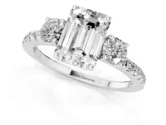 Emerald Cut Diamond Three-Stone Ring Set in White gold with Pavé Band and Graduated Sides