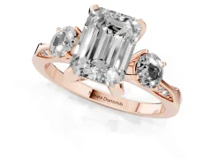 Fancy Pink Emerald Cut Diamond Three-Stone Ring Set in Rose gold with Pavé Band and Smaller Side Stones
