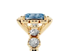Fancy Blue Emerald Cut Diamond Floral Halo Ring Set in Yellow gold with Shared Prong Band