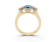 Fancy Blue Emerald Cut Diamond Three-Stone Ring Set in Yellow gold with Plain Polished Band