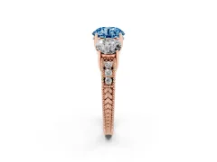 Fancy Blue Round Cut Diamond Three-Stone Engagement Ring Set in Rose gold with Milgrain Pavé Band