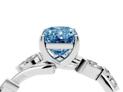 Fancy Blue Radiant Cut Diamond Solitaire Ring Set in White gold with Twisted Marquise Accent Band