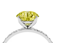 Fancy Yellow Round Cut Diamond Solitaire Engagement Ring Set in Platinum with Round Pavé Band and Prong Setting