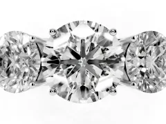 Round Cut Diamond Three-Stone Ring Set in Platinum with Textured Band