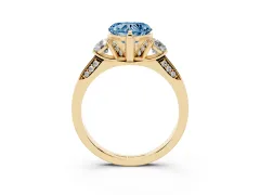 Fancy Blue Heart Cut Diamond Three-Stone Ring Set in Yellow gold with Pavé Band and Smaller Side Stones
