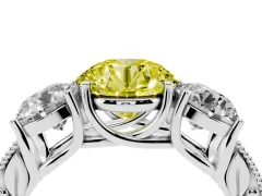Fancy Yellow Round Cut Diamond Three-Stone Engagement Ring Set in White gold with Milgrain Pavé Band