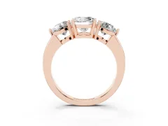 Round Cut Diamond Three-Stone Ring Set in Rose gold with Prong Setting and Plain Band