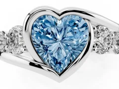 Fancy Blue Heart Cut Diamond Bezel Bypass Ring Set in Platinum with Round Accents