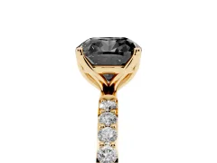 Fancy Black Cushion Cut Diamond Solitaire Engagement Ring Set in Yellow gold with Round Pavé Band and Prong Setting