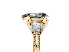 Fancy Black Pear Cut Diamond Three-Stone Ring Set in Yellow gold with Pavé Band and Smaller Side Stones