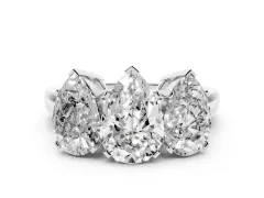 Pear Cut Diamond Three-Stone Ring Set in White gold with Channel-Set Band and Prong Settings
