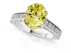 Fancy Yellow Oval Cut Diamond Solitaire Ring Set in White gold with Milgrain-Edged Pavé Band and Prong Setting