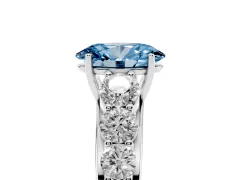 Fancy Blue Oval Cut Diamond Solitaire Ring Set in Silver with Pavé-Set Band and Prong Setting
