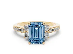 Fancy Blue Emerald Cut Diamond Three-Stone Pavé Ring Set in Yellow gold with Prong Setting