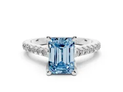 Fancy Blue Emerald Cut Diamond Solitaire Ring Set in Silver with Brilliant Pavé Band and Prong Setting