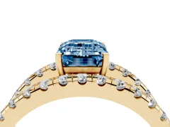 Fancy Blue Emerald Cut Diamond Split Shank Pavé Solitaire Ring Set in Yellow gold with Open Shank Design