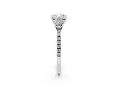 Cushion Cut Diamond Three-Stone Ring Set in Platinum with Pavé Band and Graduated Sides