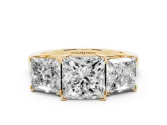 Princess Cut Diamond Three-Stone Ring Set in Yellow gold with Channel-Set Band and Prong Settings