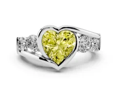 Fancy Yellow Heart Cut Diamond Bezel Bypass Ring Set in White gold with Round Accents