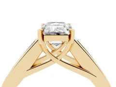 Emerald Cut Diamond Solitaire Ring Set in Yellow gold with Channel-Set Accent Stones and Prong Setting