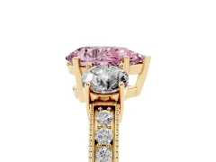 Fancy Pink Pear Cut Diamond Three-Stone Ring Set in Yellow gold with Round Side Stones and Pavé Band