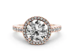 Round Cut Diamond Halo Ring Set in Rose gold with Pavé Shoulders and Halo-Framed Center