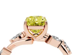 Fancy Yellow Radiant Cut Diamond Solitaire Ring Set in Rose gold with Twisted Marquise Accent Band