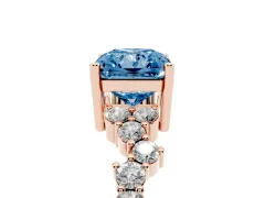 Fancy Blue Radiant Cut Diamond Ring Set in Rose gold with Scattered Round Accents
