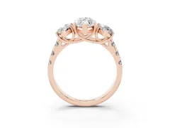 Marquise Cut Diamond Three-Stone Ring Set in Rose gold with Pavé Band