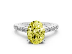 Fancy Yellow Oval Cut Diamond Solitaire Ring Set in White gold with Brilliant Pavé Band and Prong Setting