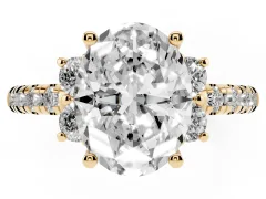 Oval Cut Diamond Three-Stone Pavé Ring Set in Yellow gold with Prong Setting