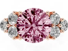 Fancy Pink Round Cut Diamond Solitaire Ring Set in Rose gold with Cluster Accents on Each Side