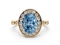 Fancy Blue Oval Cut Diamond Halo Engagement Ring Set in Yellow gold with Twisted Band and Prong Setting