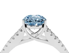 Fancy Blue Oval Cut Diamond Split Shank Pavé Engagement Ring Set in Platinum with Prong-Held Center Stone