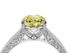 Fancy Yellow Oval Cut Diamond Solitaire Ring Set in White gold with Milgrain-Edged Pavé Band and Prong Setting