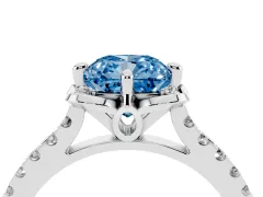 Fancy Blue Cushion Cut Diamond Solitaire Ring Set in Platinum with Pavé Band and Floral Prong Setting