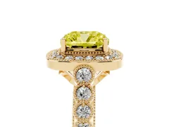 Fancy Yellow Cushion Cut Diamond Milgrain Halo Solitaire Ring Set in Yellow gold with Bezel Set Side Stones and Pavé Band