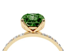 Fancy Green Radiant Cut Diamond Solitaire Engagement Ring Set in Yellow gold with Round Pavé Band and Prong Setting