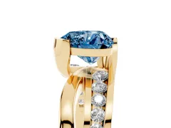 Fancy Blue Heart Cut Diamond Solitaire Ring Set in Yellow gold with Channel Set Split Shank and Tension Prongs