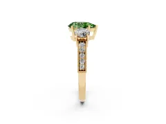 Fancy Green Pear Cut Diamond Three-Stone Ring Set in Yellow gold with Round Side Stones and Pavé Band