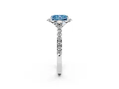Fancy Blue Radiant Cut Diamond Solitaire Ring Set in Platinum with Pavé Band and Floral Prong Setting