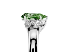 Fancy Green Pear Cut Diamond Three-Stone Ring Set in White gold with Bold Center and Classic Band