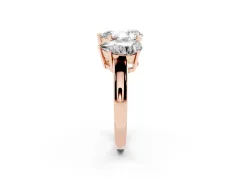 Pear Cut Diamond Three-Stone Ring Set in Rose gold with Channel-Set Band and Prong Settings