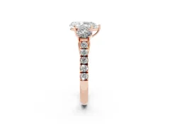 Pear Cut Diamond Three-Stone Ring Set in Rose gold with Round Side Stones and Delicate Pavé Band